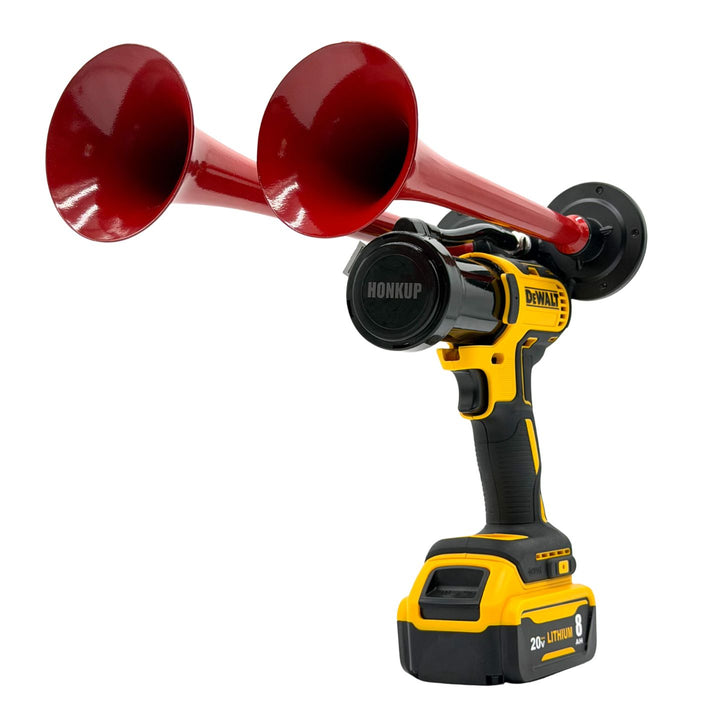 A cordless power tool–style battery double horn air compressor with two red horn bells, black and yellow DeWalt battery pack

